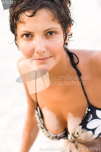 Image of  brunet woman on a beach