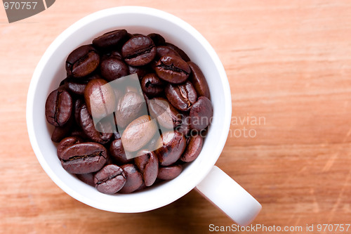 Image of cup full of coffee beans