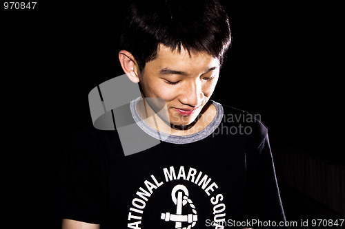 Image of portrait of handsome smiley man over dark background 