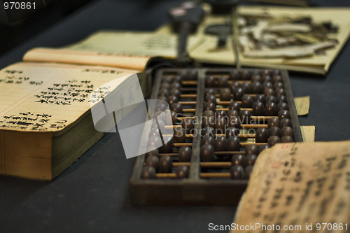 Image of abacus and book on the table 