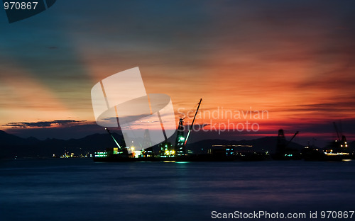 Image of sunset at coast of the sea 