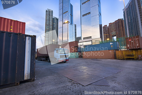 Image of container site before modern building 