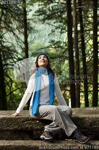 Image of Happy young woman in nature