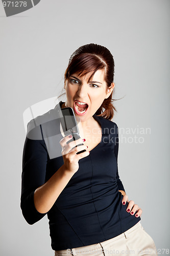 Image of Unhappy woman at cellphone