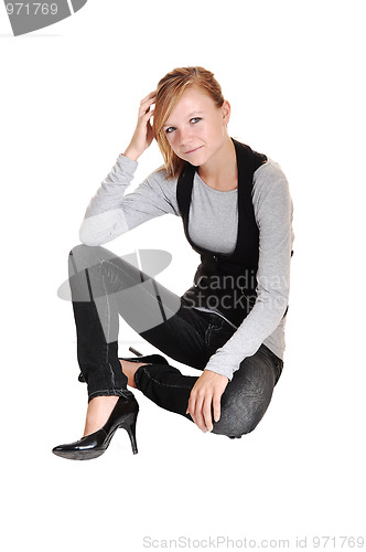 Image of Girl sitting on floor.