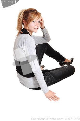 Image of Girl sitting on floor.