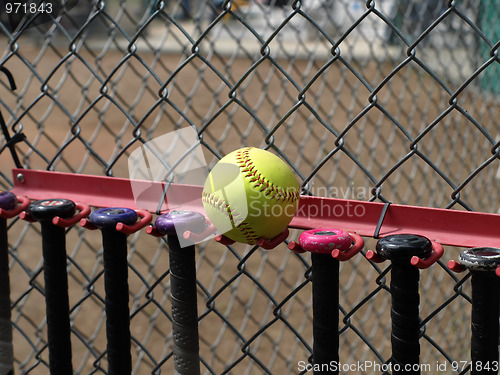 Image of Yellow Softball and Bats