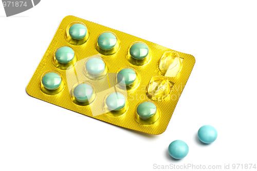 Image of Set of green pills isolated on white 