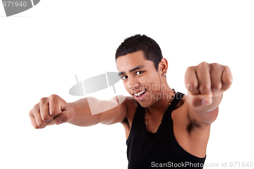 Image of Portrait of a very happy  young latin man with his arms raised