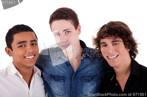 Image of friends: three young man of different colors,looking to camera and smiling