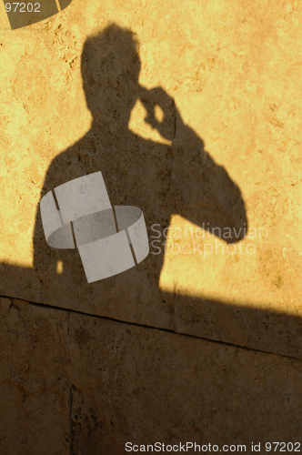 Image of Man Shadow on Phone