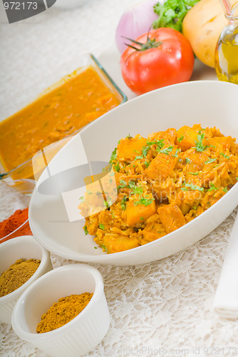 Image of curry beef rice and potatoes