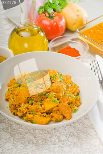Image of curry beef rice and potatoes