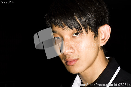 Image of Portrait of an Asian man in the darkness