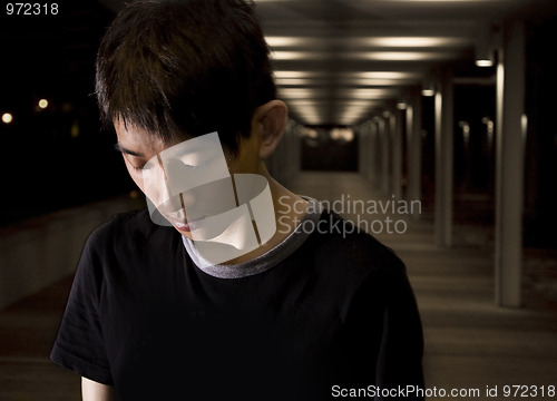 Image of Portrait of an Asian man in the darkness