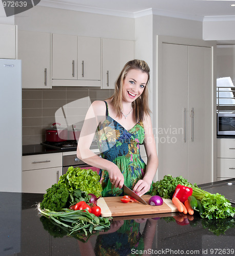 Image of young woman preparing healthy vegetables