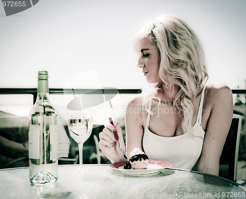 Image of wine and dessert in cafe