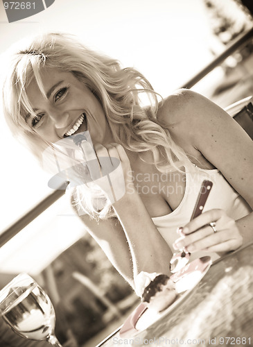 Image of wine and dessert in cafe