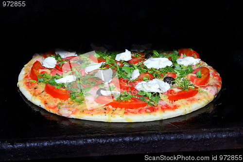 Image of pizza in oven