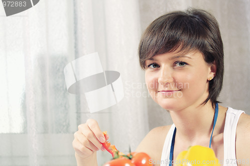 Image of Housewife with slice of paprika