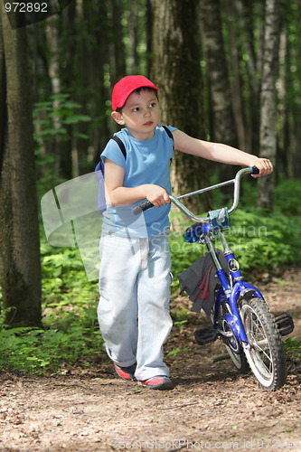 Image of Boy with bicycle