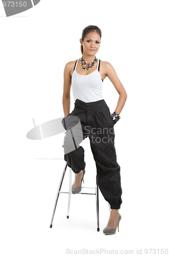 Image of beautiful young asian woman on bar chair