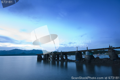 Image of wood bridge and the sea at sunrise 