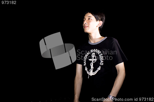 Image of portrait of handsome smiley man over dark background 