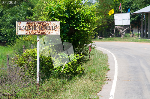 Image of Rusty road sign in rural Thailand