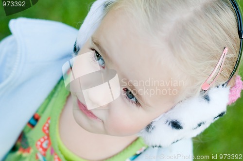 Image of Little girl playing outside