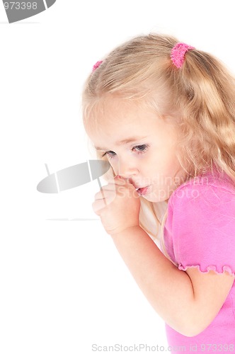 Image of Little cute girl in studio eating candy