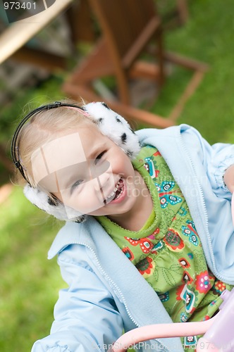 Image of Little girl playing outside
