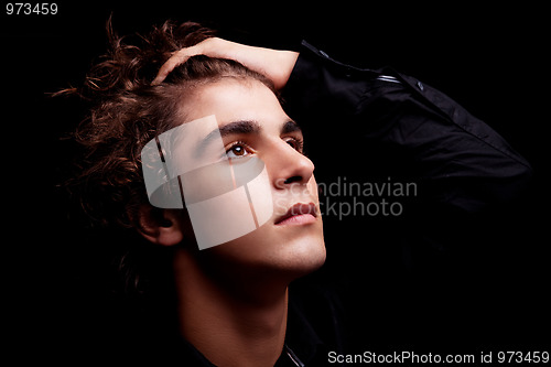 Image of cute boy, smiling and looking up on black