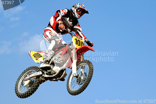 Image of red motocross in the sky