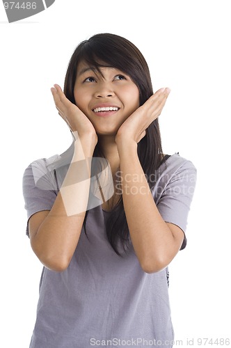 Image of scared young woman looking up