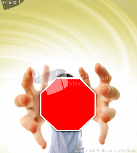 Image of Man grabing a red sign.