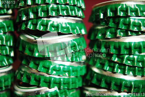 Image of pile of green beer caps