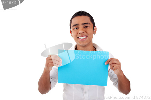 Image of young latin man, with blue  card in hand, smiling