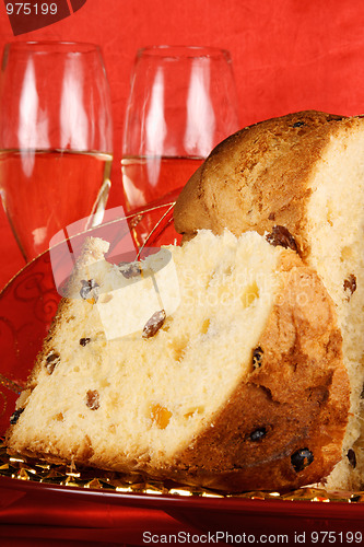 Image of Christmas composition with panettone and spumante