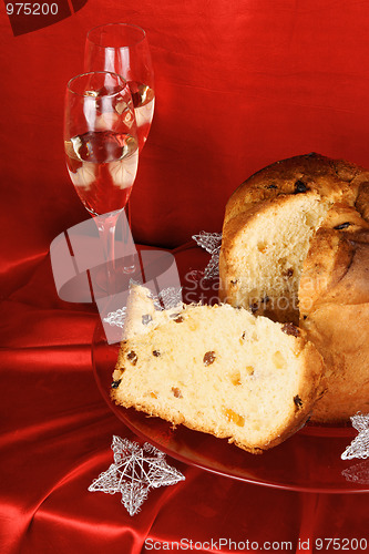 Image of Christmas composition with panettone and sparkling wine