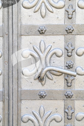 Image of Close up of ancient metal door with handle