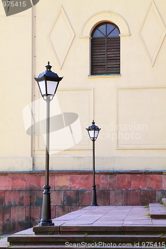 Image of Two street lamps and window