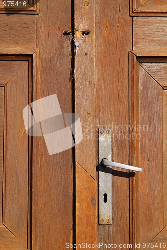Image of Wooden door detail with handle