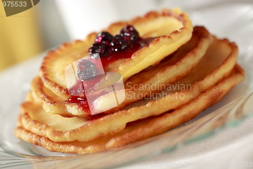 Image of Pile of pancakes with fruit sauce