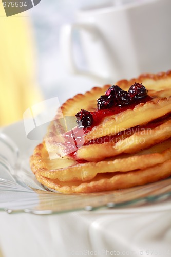 Image of Pile of pancakes with fruit sauce