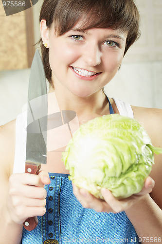 Image of Woman with cabbage and knife