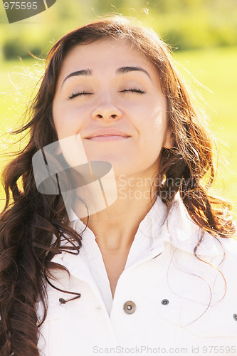 Image of Young contented brunette