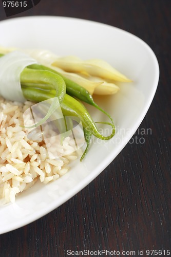 Image of Bean's pods and rice on plate
