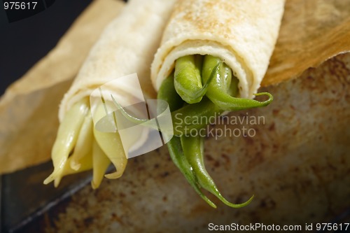 Image of Pancakes wrapped bean's pods