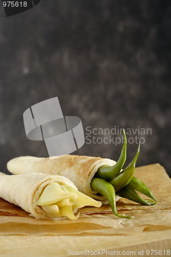 Image of Pancakes wrapped bean's pods